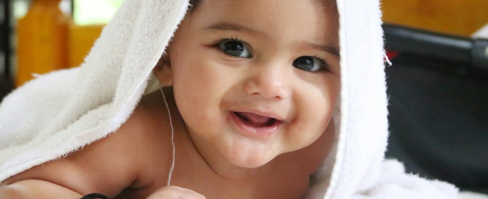 girl in white towel on head